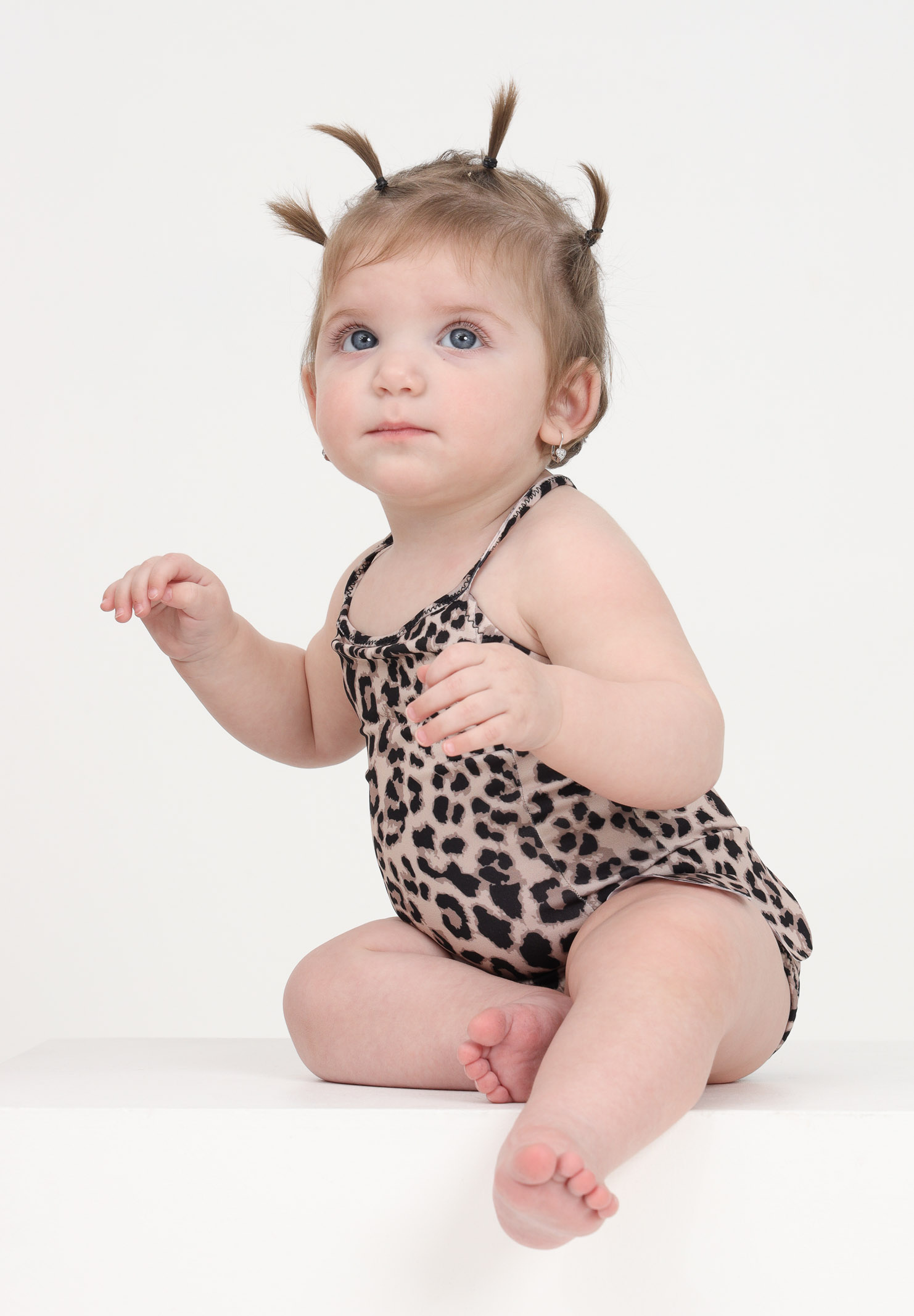 Spotted one-piece swimsuit for a newborn