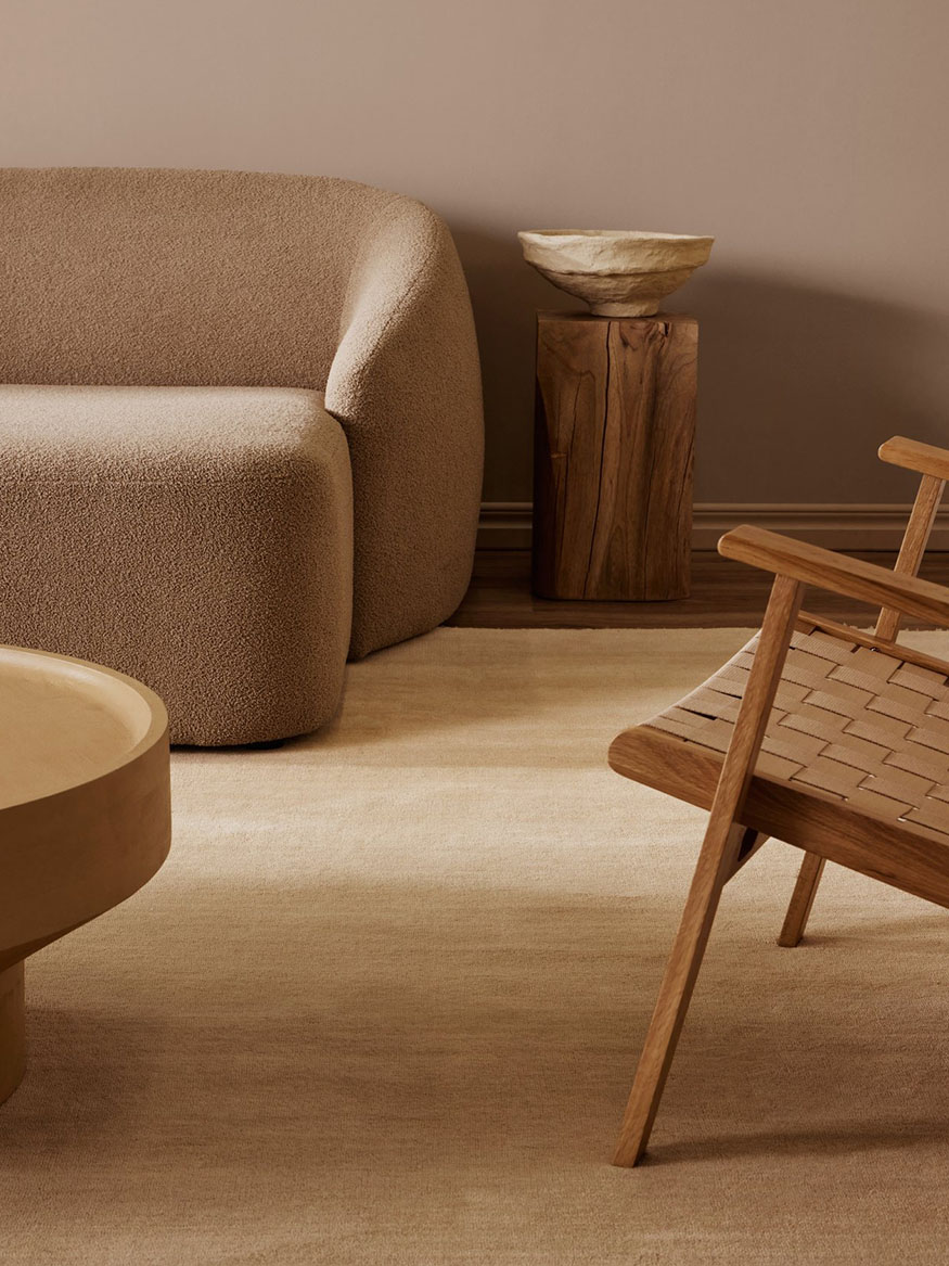 Single colored creme beige wool rug in living room