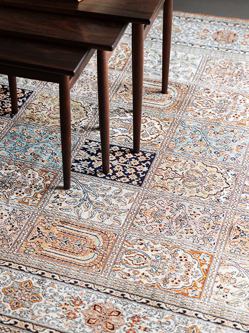 Hand knotted silk rug in light colors