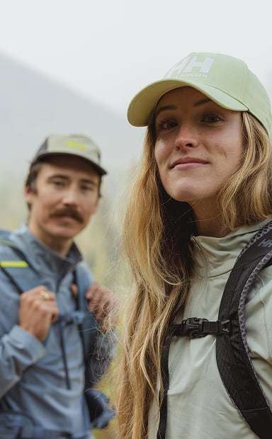 Man and woman hiking in Helly Hansen gear