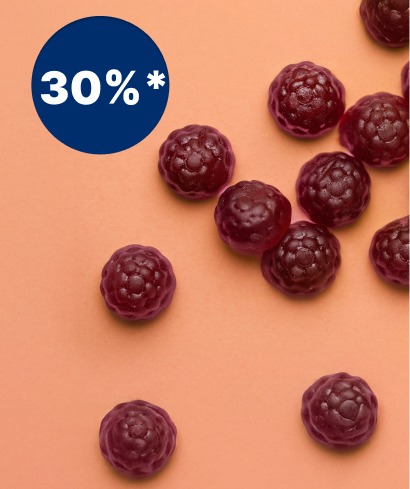 alt="Caramelle gommose a forma di bacca viola su sfondo pesca con un'etichetta blu di sconto del 30%."