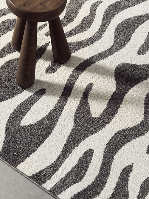 Close up on a black and white rug
