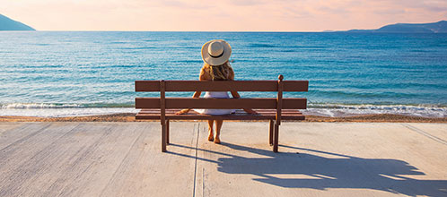 Girl on the bench in summer