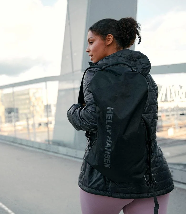 Woman wearing Helly Hansen backpack in the city