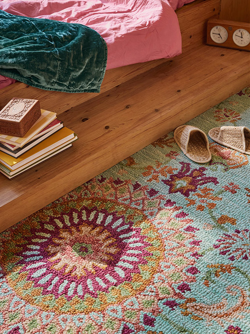 Eclectic styled rug in a bedroom