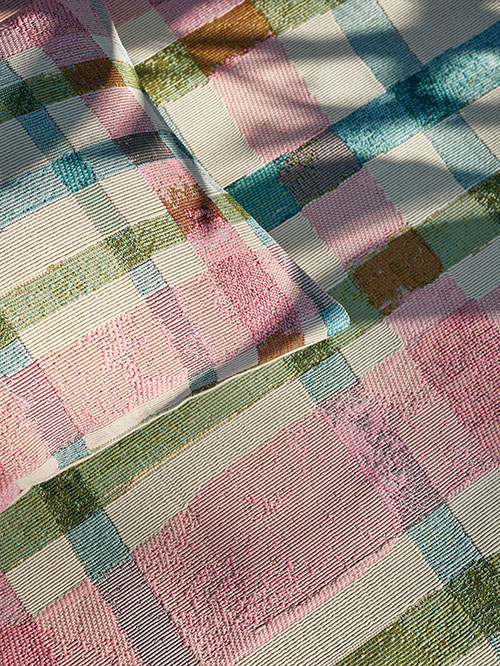 Matching colorful cushion cover and rug