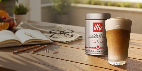 illy whole bean Classico and Intenso cans on a counter