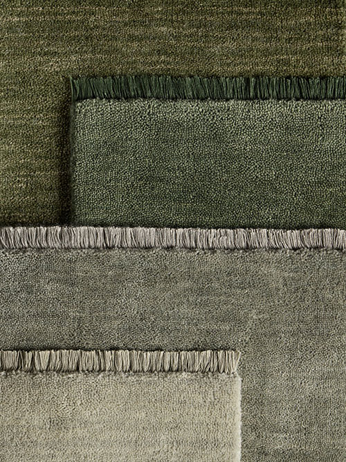 Collage of four green rugs