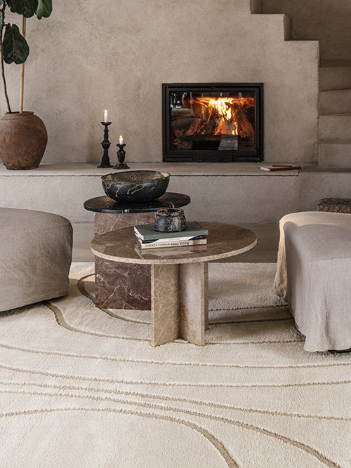 Beige rug with brown lines in a living room