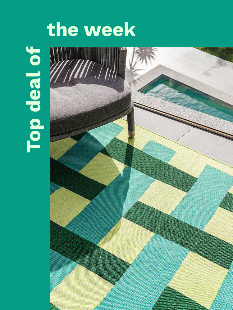 Round beige outdoor rug in an outdoor space