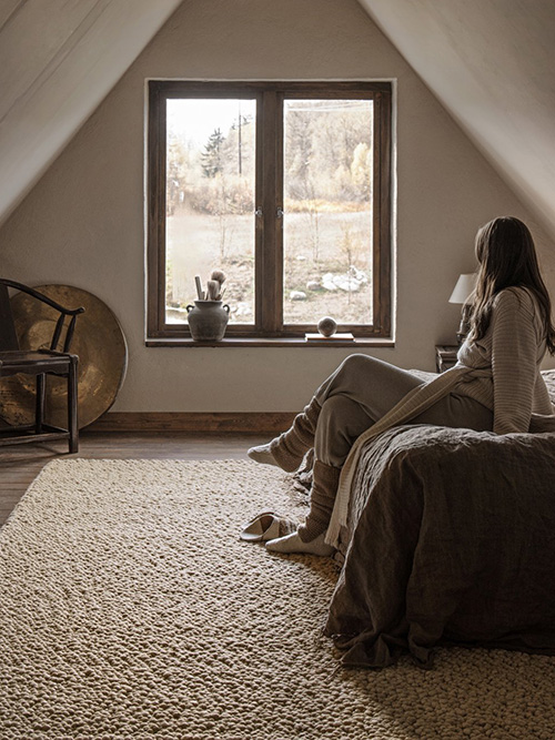 Bubble structured beige rug in a bedroom