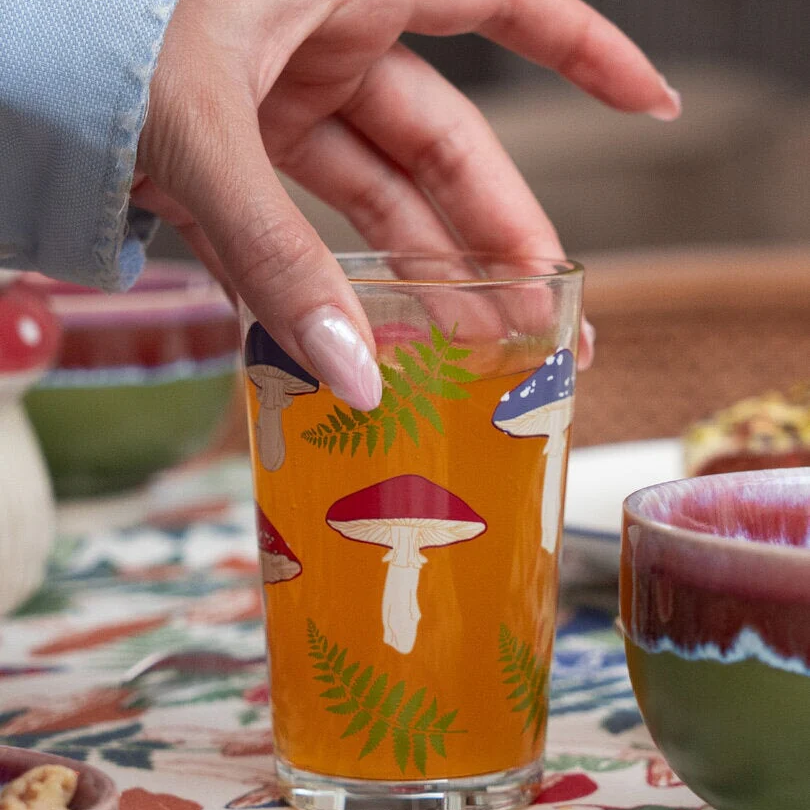 Drinking glass with mushrooms