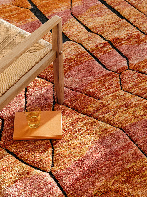 Close up on a pink and orange berber rug