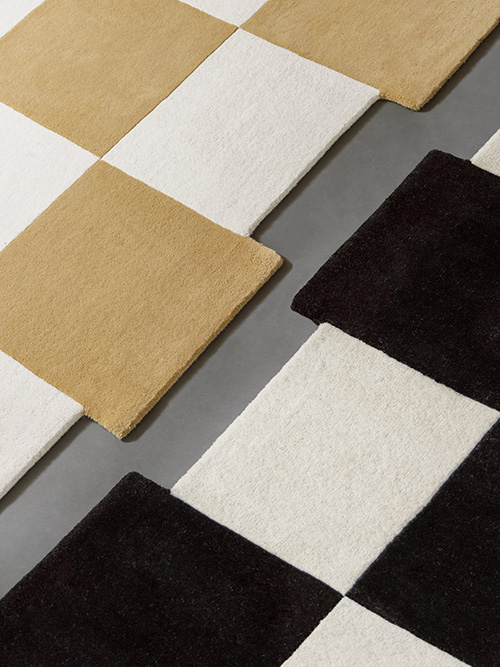 Close up on two checkered irregular rugs