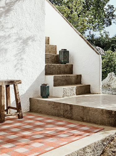Red checkered rug in an outdoor space