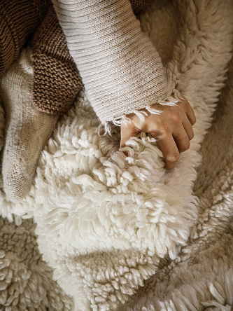 Close up on a shaggy white rug