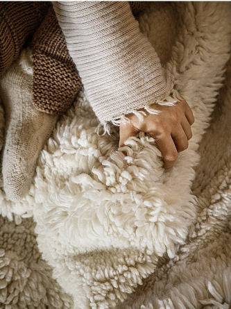 Close up on a handmade white shaggy rug