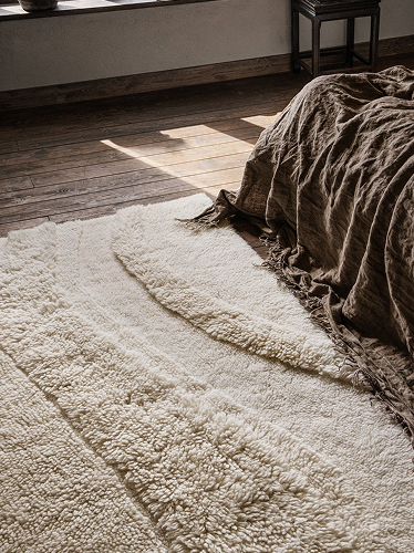 Handmade shaggy rug in a bedroom