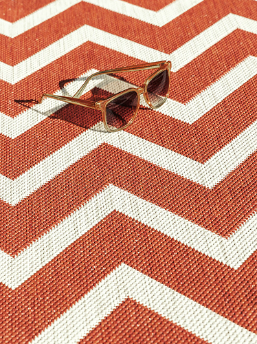Close up on a red outdoor rug
