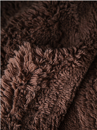 Close up on a brown shaggy rug