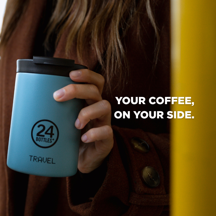 A young girls is holding her Travel Tumbler