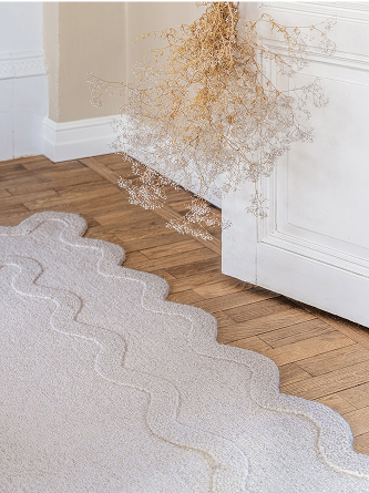 Odd shaped off white rug