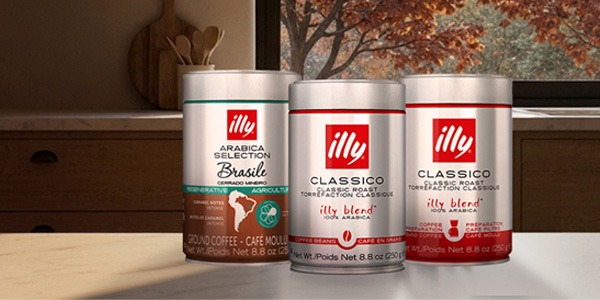 illy whole bean Classico and Intenso cans on a counter