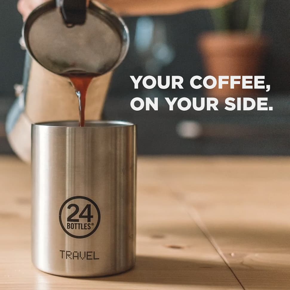 A young girls is holding her Travel Tumbler