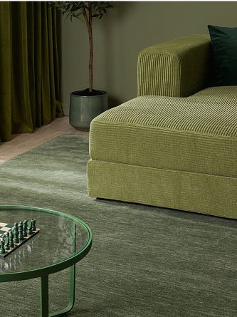 Green single coloured rug