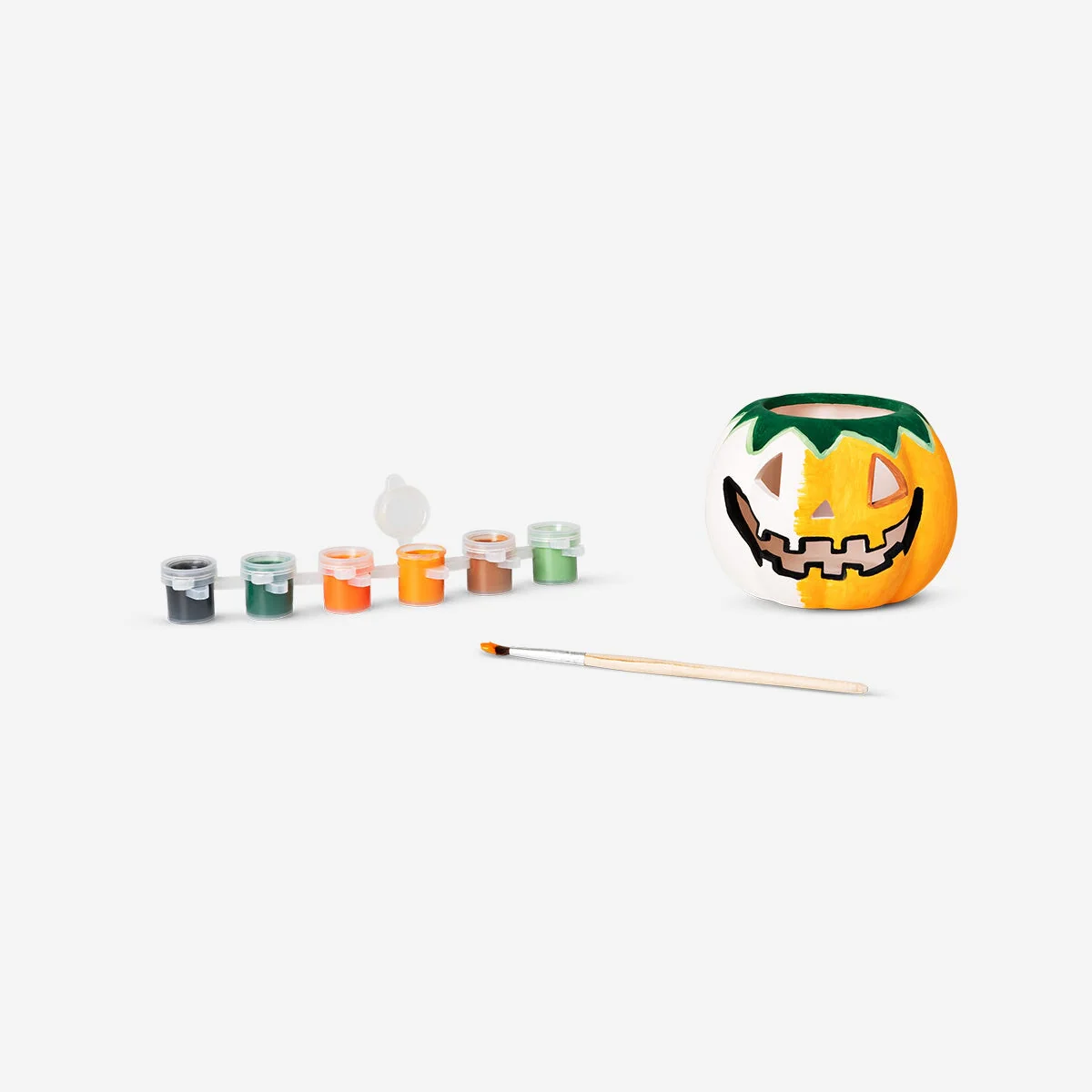 DIY pumpkin tealight holder with paint and brush