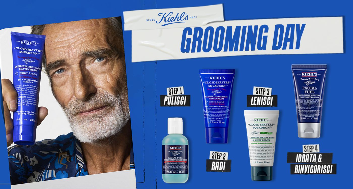 Uomo maturo con barba grigia tiene in mano la crema da barba Kiehl’s Ultimate Brushless Shave Cream White Eagle. Accanto, i prodotti del set The Grooming Collection disposti in quattro step su sfondo blu.