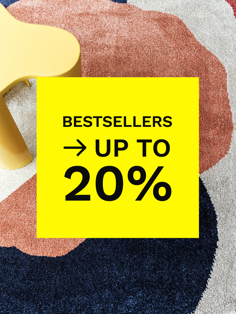 Beige machine-made rug with pink floral border