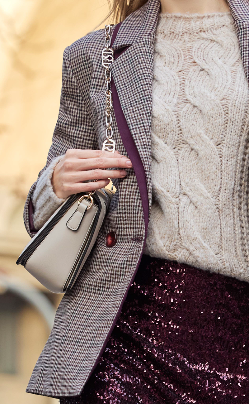 Maglia panna con lavorazione a trecce