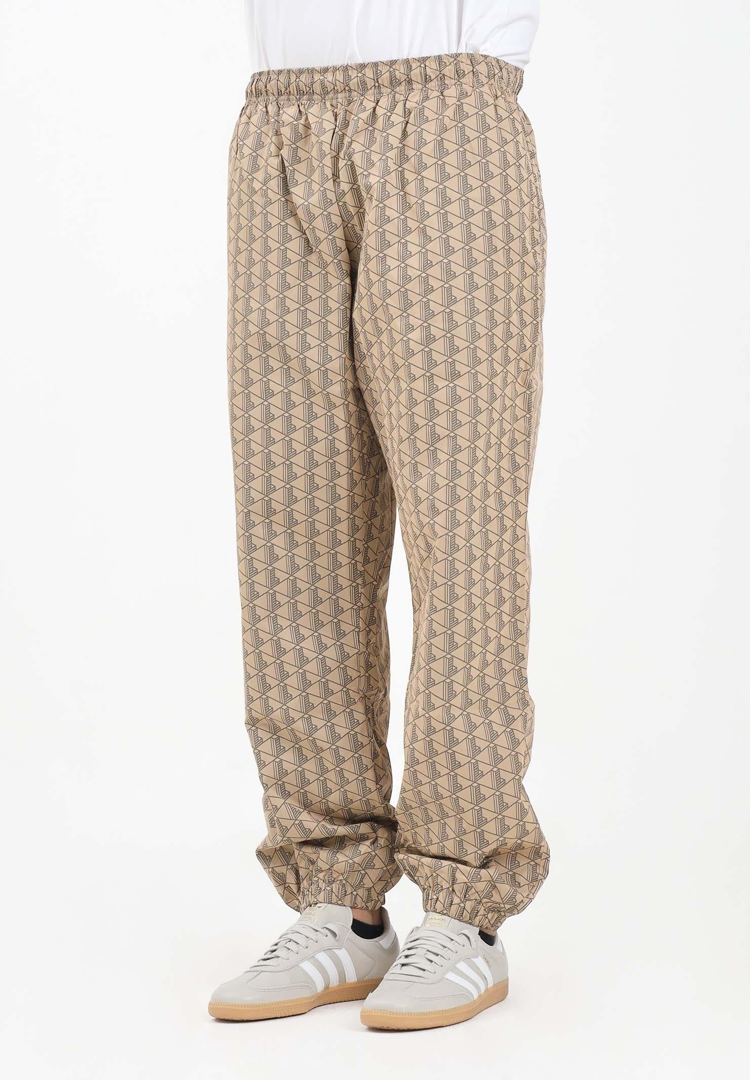 Image of LACOSTE Pantalone sportivo beige da uomo con monogramma