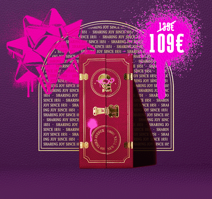 Immagine promozionale del Calendario dell’Avvento Kiehl’s – 24 giorni. Al centro un cofanetto rosso con chiusure dorate e logo Kiehl’s, su sfondo viola decorato con la scritta “SHARING JOY SINCE 1851”. In alto a sinistra un grande fiocco spray fucsia e a destra il prezzo scontato 109€ (139€ barrato).