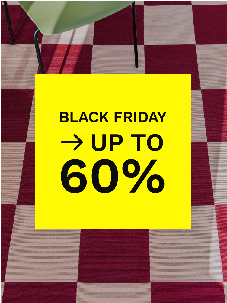 Beige machine-made rug with pink floral border