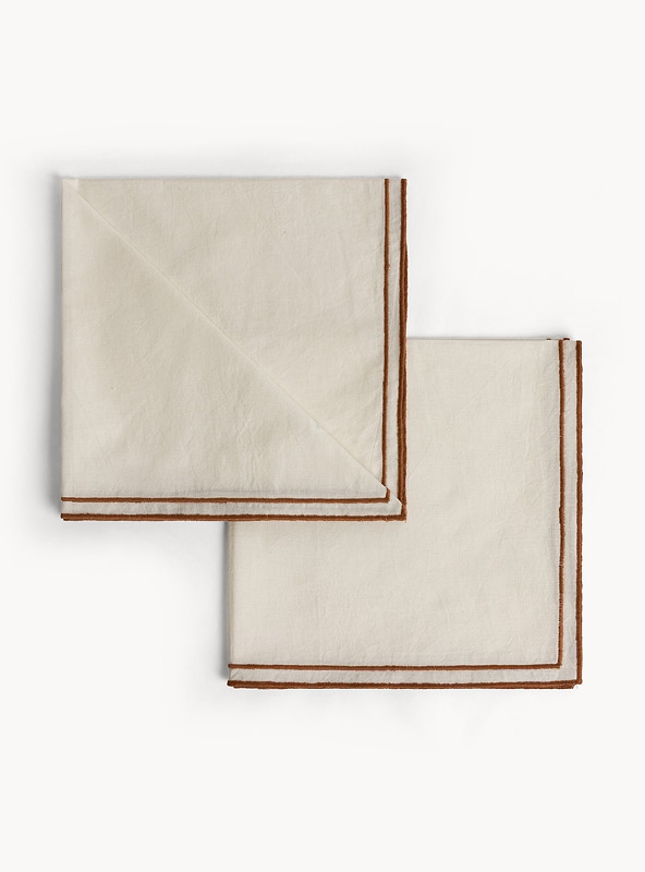 Set 2 tovaglioli in cotone con overlock a contrasto