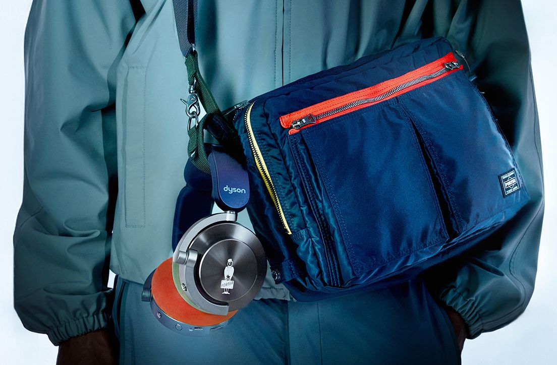 A close up of the PORTER shoulder bag showing the headphone holder.