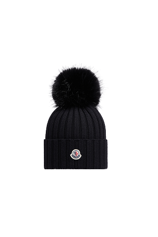 Berretto in lana con pompon in materiali sintetici
