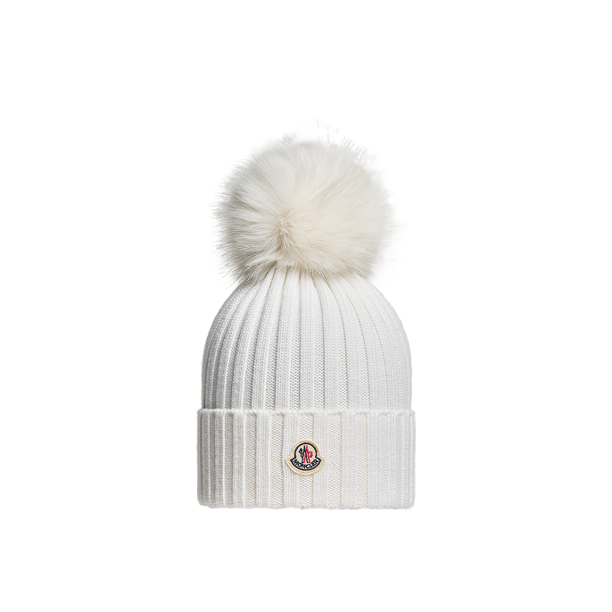 Berretto in lana con pompon in materiali sintetici