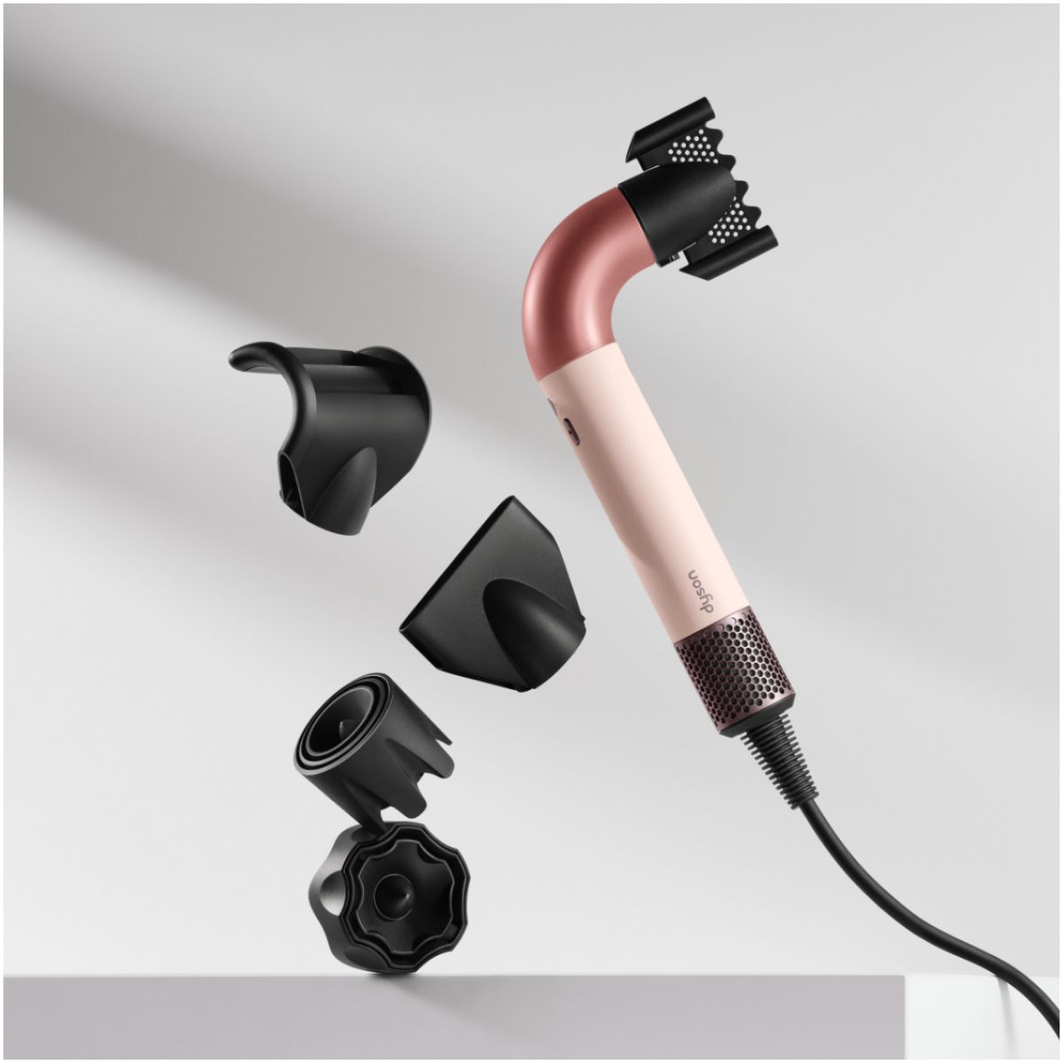 The Dyson Supersonic r hair dryer is used by a team of stylists to style a model’s hair at a fashion event.