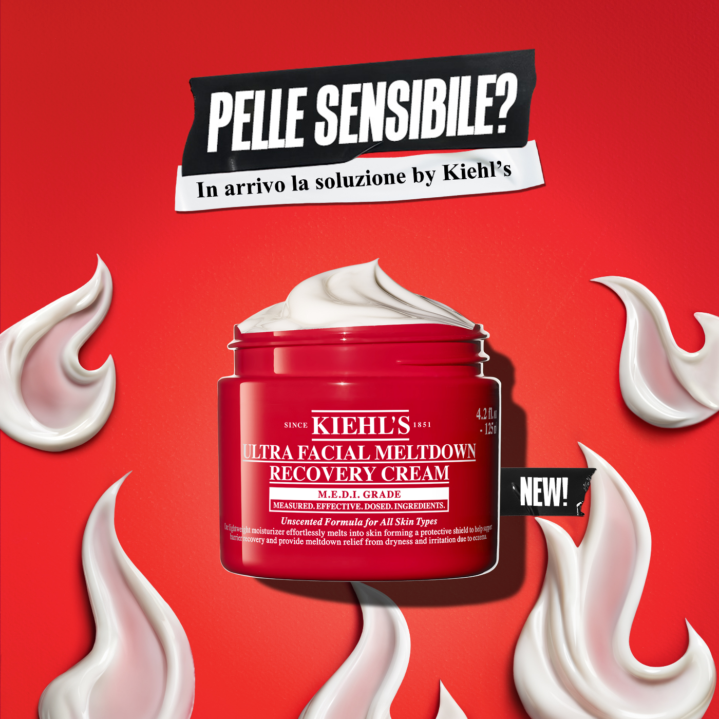 Vasetto rosso di Ultra Facial Meltdown Recovery Cream di Kiehl&rsquo;s con texture bianca visibile in superficie, su sfondo rosso acceso. Intorno al prodotto sono presenti pennellate di crema. In alto compare il testo &ldquo;Pelle sensibile? In arrivo la soluzione by Kiehl&rsquo;s&rdquo; e sul lato la scritta &ldquo;New&rdquo;.