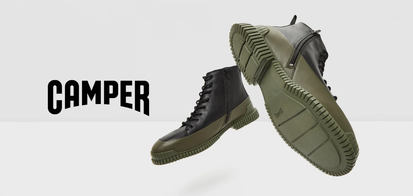 Sneaker alte in pelle nera e gomma verde oliva con suola testurizzata e design con lacci. Accentuate da colori a contrasto.