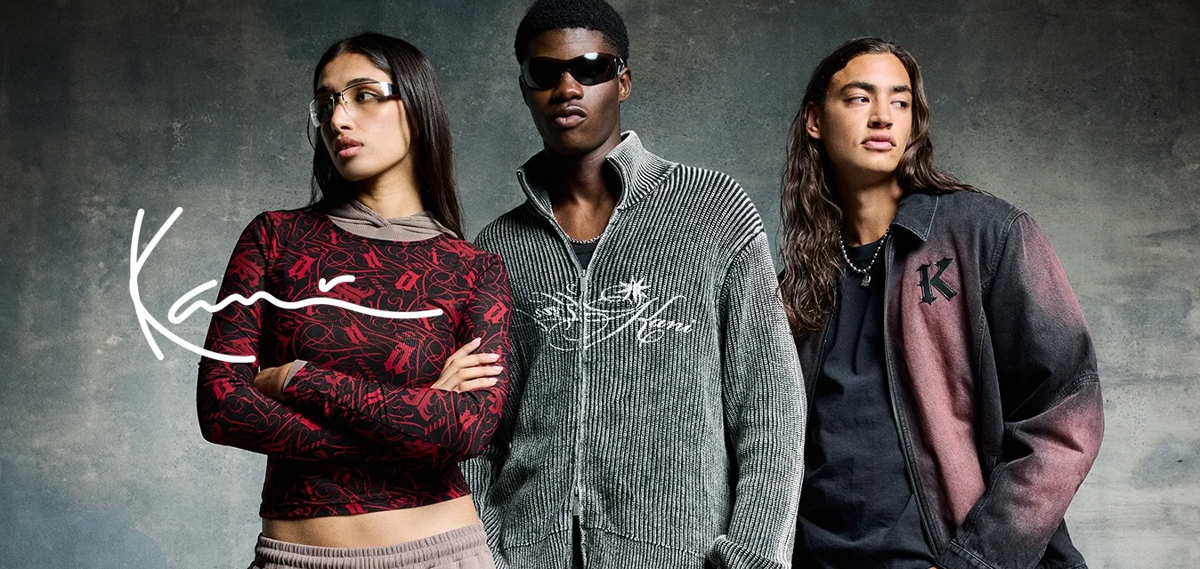 Tre individui in moda urbana: top a motivi rossi, maglione grigio con zip e giacca in denim nera-rossa. Texture e colori diversi.