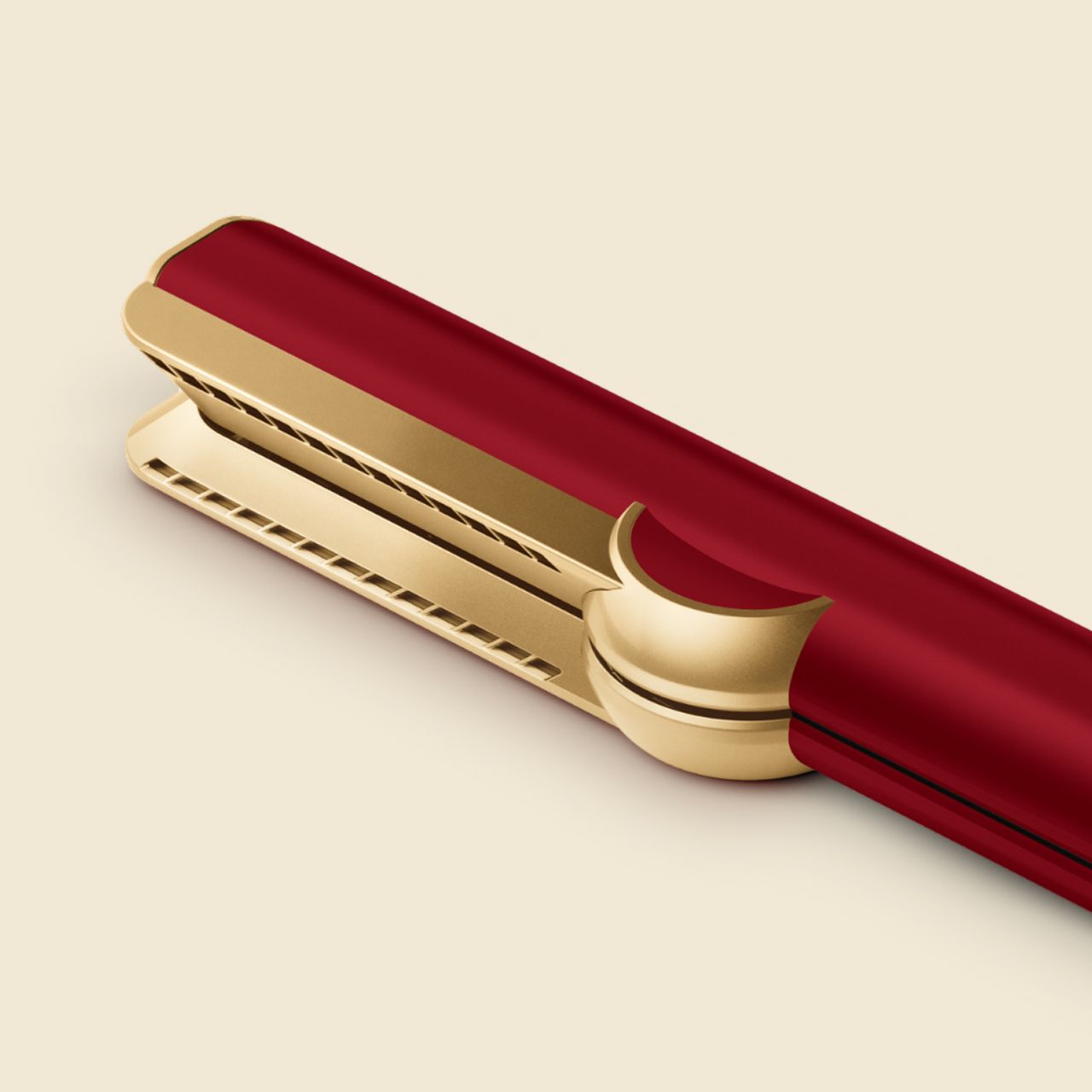 The Dyson Airstrait dryer and straightener in Red velvet and gold.
