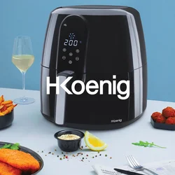 Friggitrice ad aria nera con display digitale, dettagli argentati, accanto a piatti di patatine croccanti, pesce e un bicchiere di vino bianco su una superficie chiara.