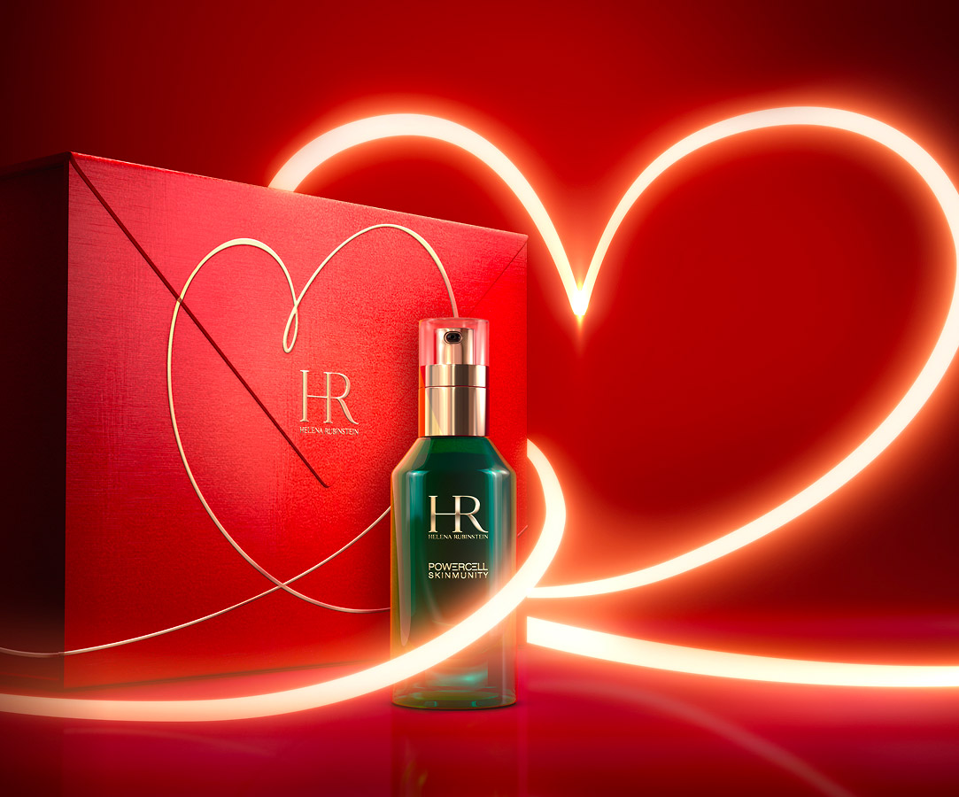 Immagine del siero Powercell con un nastro luminoso a forma di cuore che avvolge una confezione regalo rossa con un disegno a cuore simile