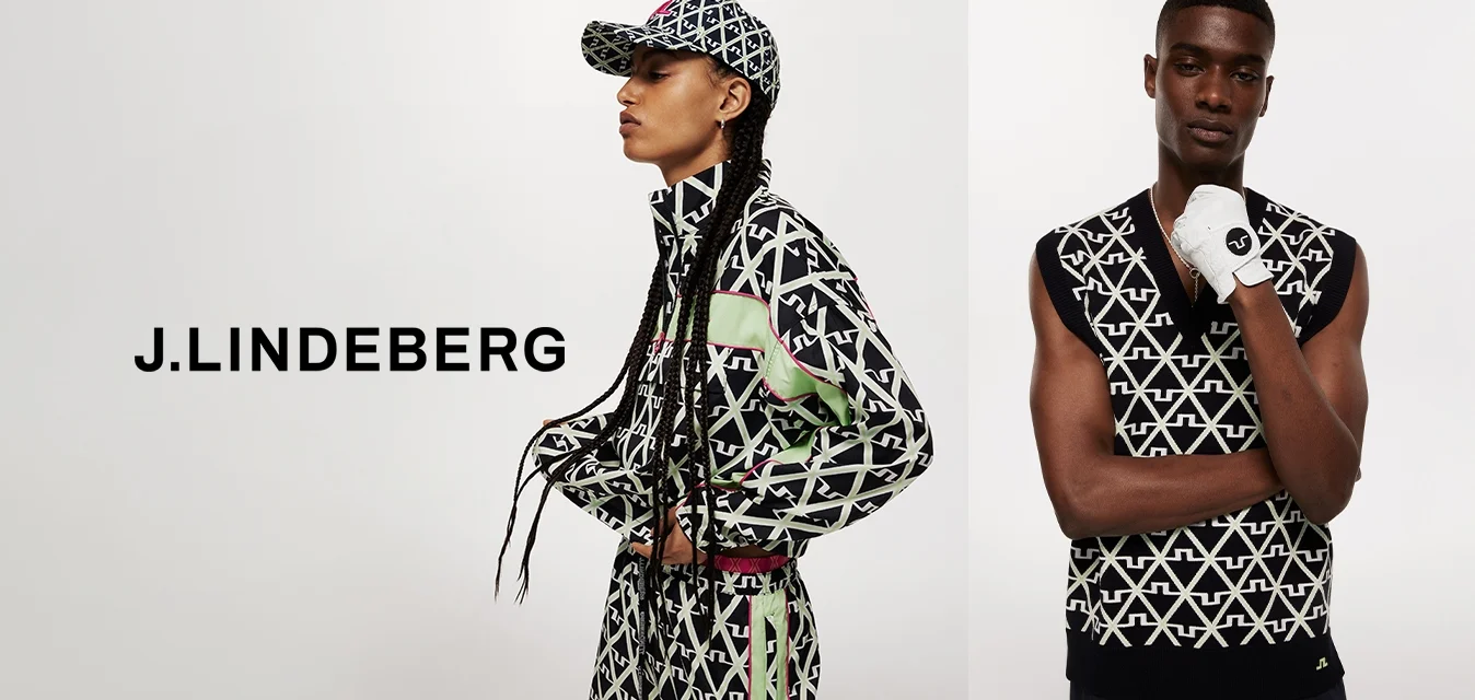 Abbigliamento sportivo con un audace motivo geometrico in nero, bianco e verde. Include una giacca con zip e un top senza maniche con dettagli.