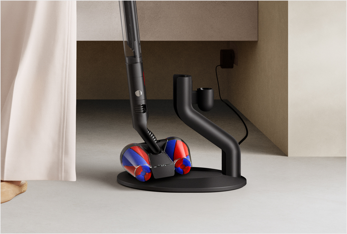 The Dyson PencilVac cleaner being placed on the dock.