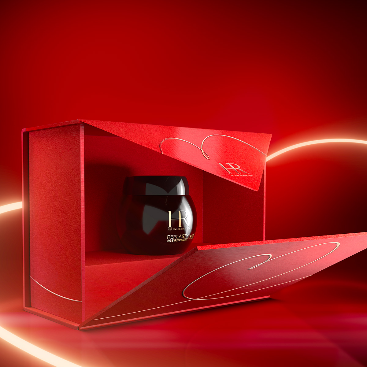 Immagine dei prodotti Age Recovery Night in una confezione regalo rossa, un nastro luminoso a forma di cuore che si avvolge attorno ad una confezione regalo di colore rosso, con un disegno del cuore simile